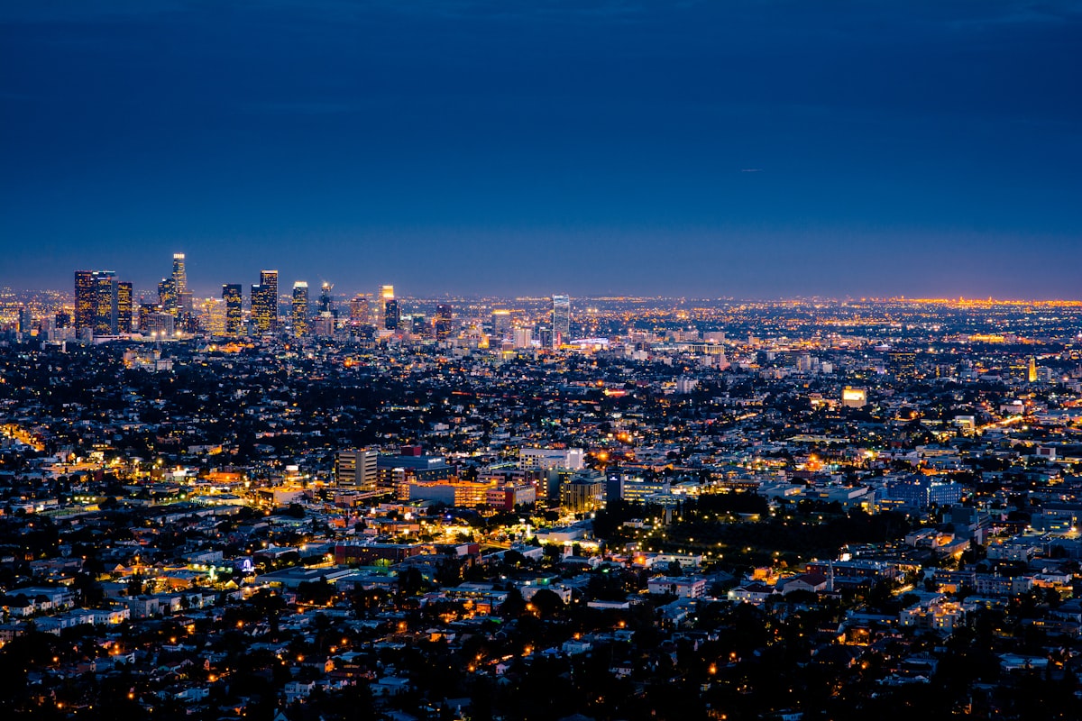 Debt relief programs in California — San Francisco skyline over financial documents